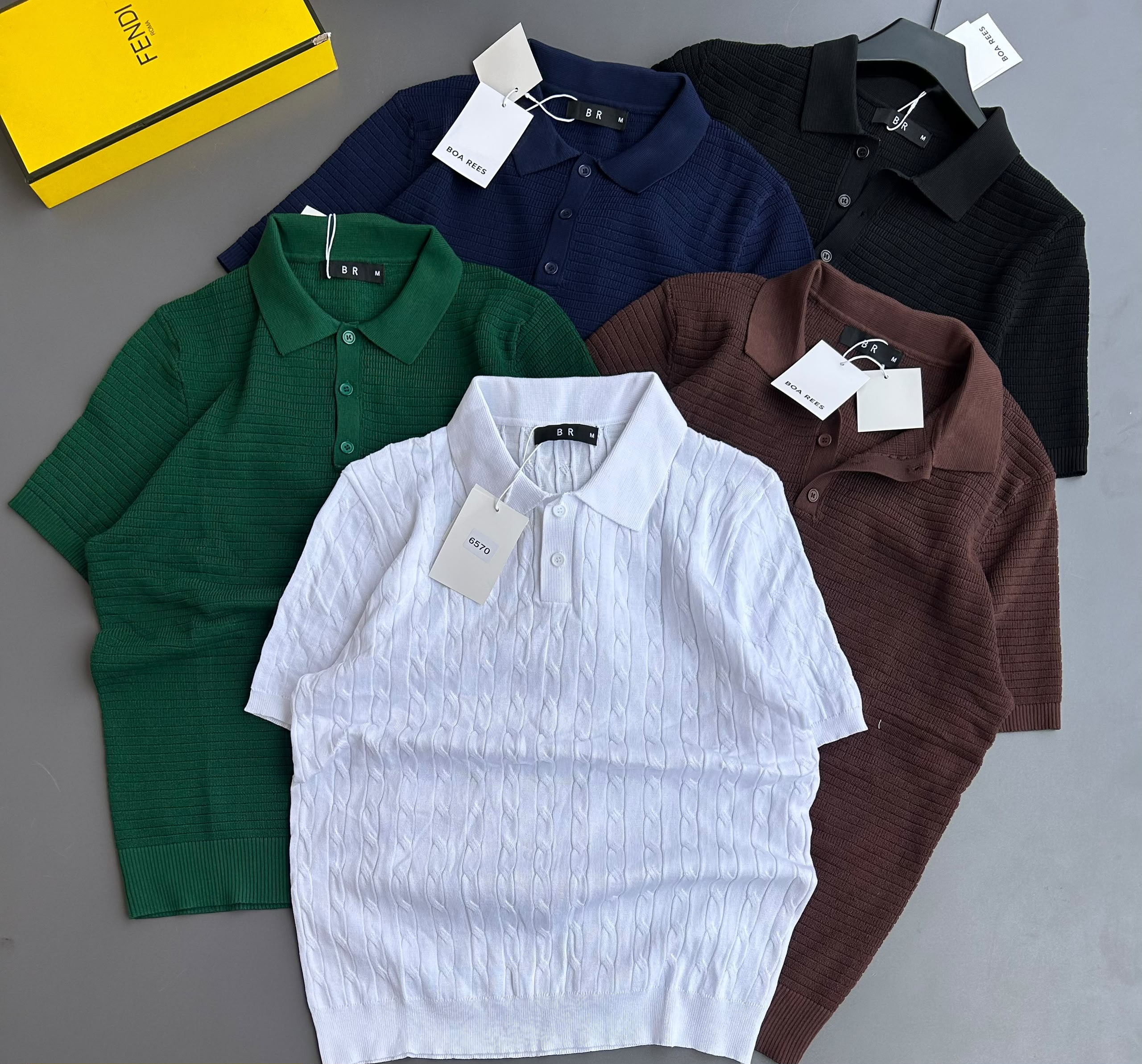 short-sleeve knit polo shirts featuring ribbed and cable-knit textured patterns, classic button plackets, and folded collars, offered in versatile solid shades including white, green, navy, brown, and black.