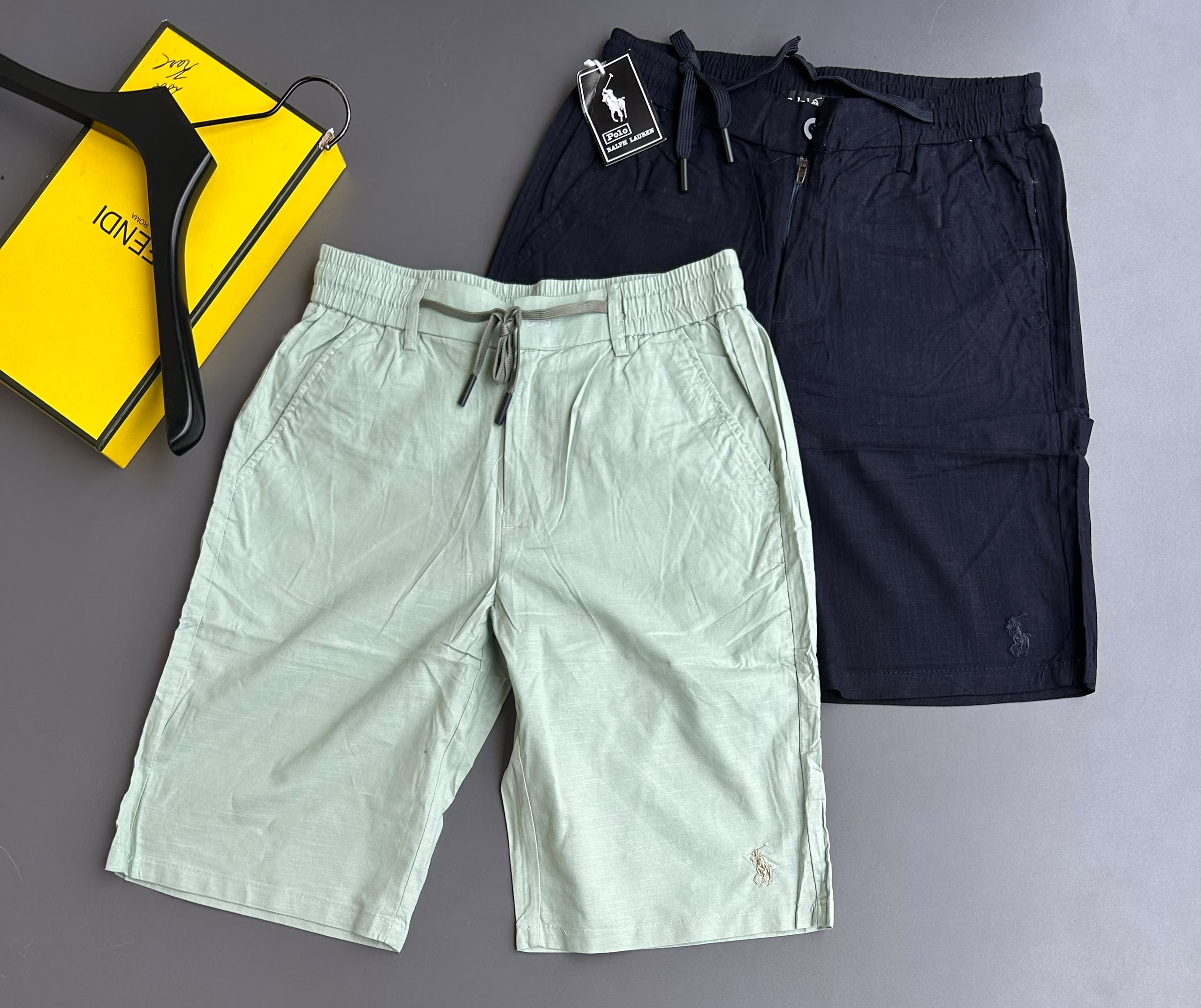 Polo Ralph Lauren Men's Drawstring Linen Shorts are lightweight, casual shorts featuring an elasticated drawstring waistband, side pockets, and signature logo embroidery, available in multiple solid colors.